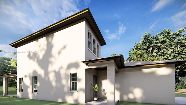 rear view of property featuring a yard