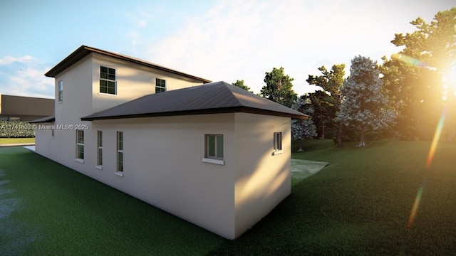 view of property exterior with a yard