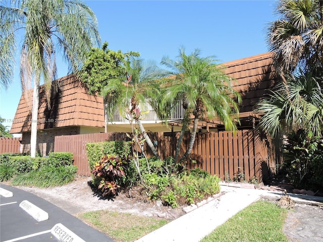 view of building exterior featuring fence