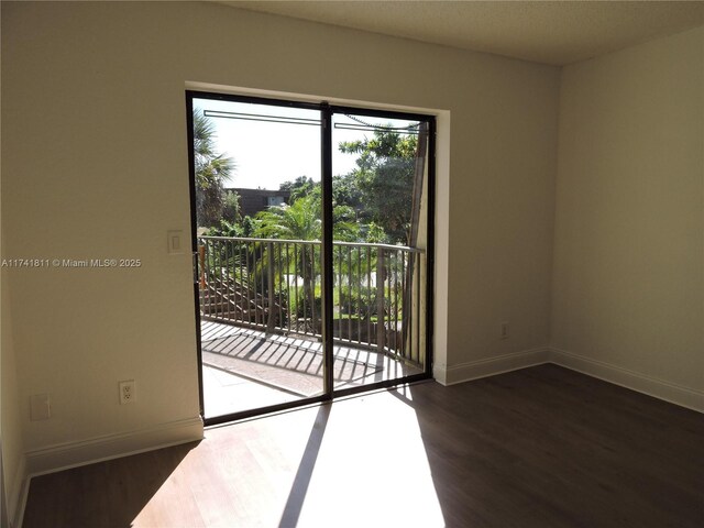 1316 SW 118th Ter Unit 1316, Davie, FL 33325 - empty room featuring baseboards and wood finished floors
