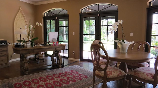 dining space featuring ornamental molding, dark hardwood / wood-style floors, and french doors