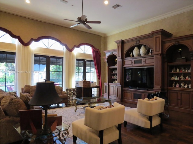 living room with crown molding, ceiling fan, and dark hardwood / wood-style flooring