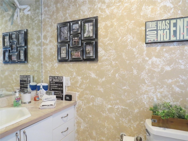 bathroom with vanity and toilet