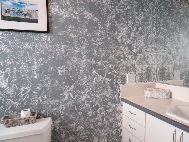 bathroom with vanity and toilet