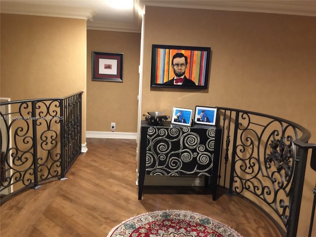 interior space with ornamental molding and wood-type flooring