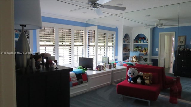 carpeted bedroom featuring ornamental molding and ceiling fan