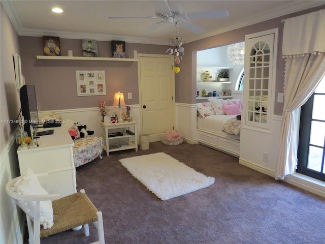 bedroom with crown molding, ceiling fan, and dark colored carpet