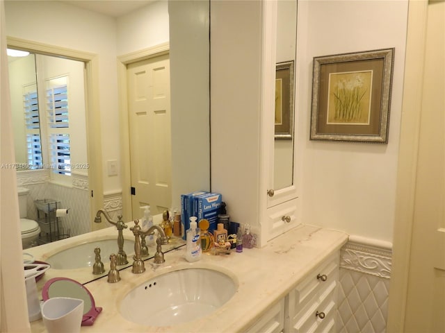 bathroom with vanity and toilet