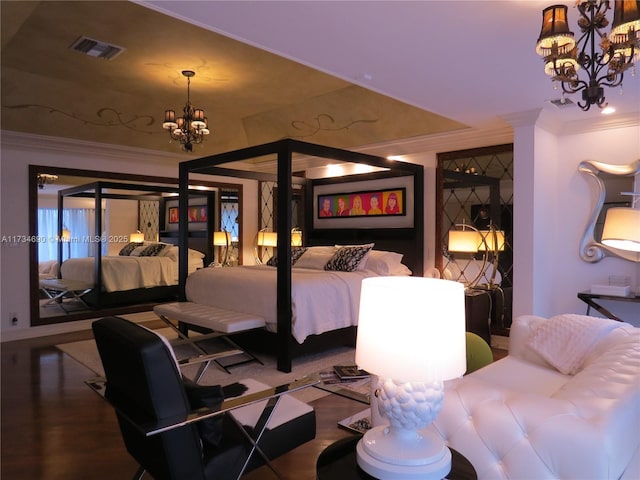 bedroom with a notable chandelier, crown molding, and hardwood / wood-style flooring