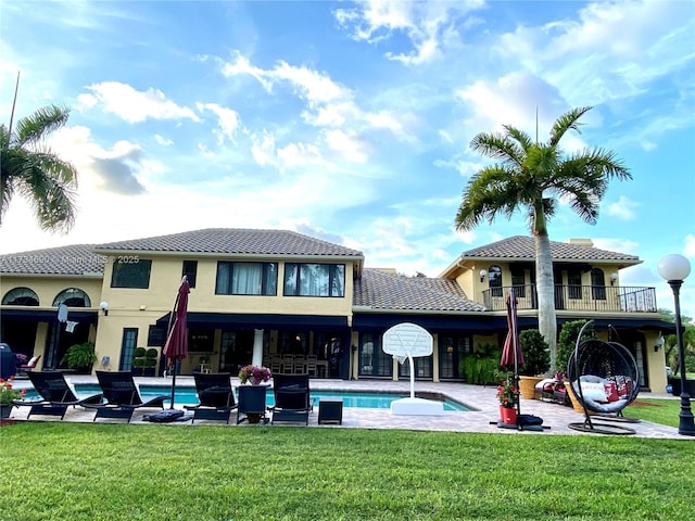 rear view of property featuring a yard