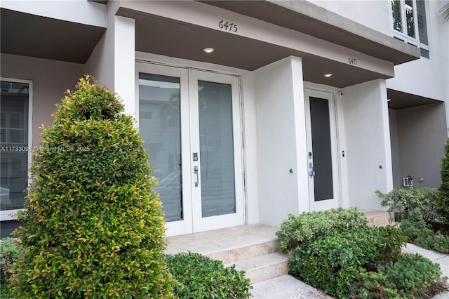 view of exterior entry featuring french doors