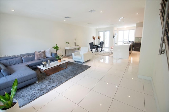 living room with light tile patterned floors