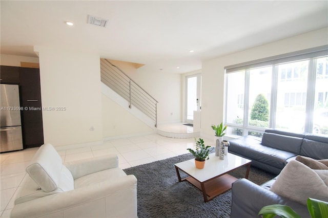 6475 NW 104th Ct Unit 6475, Doral, FL 33178 - living area with light tile patterned flooring, stairs, and recessed lighting
