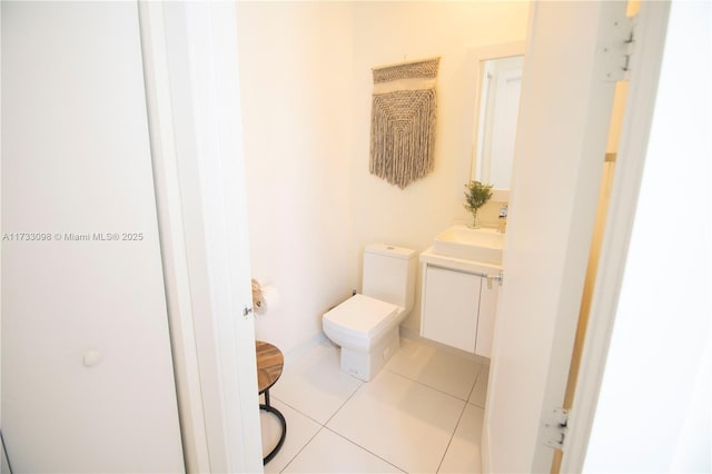 bathroom featuring tile patterned floors, toilet, and vanity