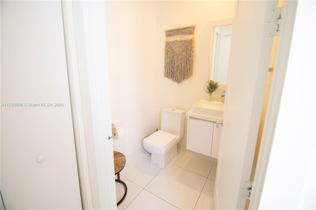 6475 NW 104th Ct Unit 6475, Doral, FL 33178 - half bathroom featuring vanity and tile patterned flooring