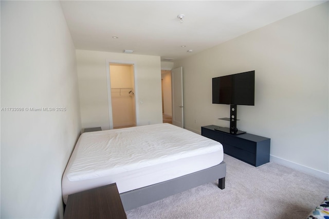 bedroom featuring light colored carpet