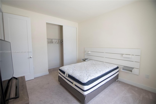 carpeted bedroom with a closet