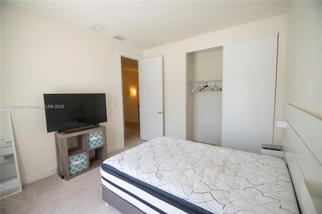 6475 NW 104th Ct Unit 6475, Doral, FL 33178 - carpeted bedroom featuring a closet and baseboards