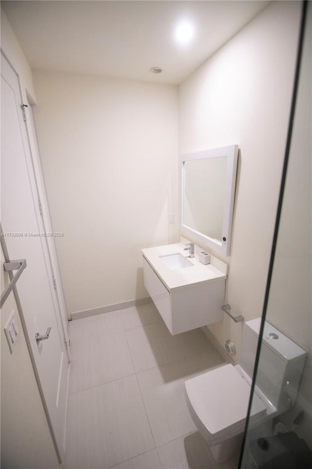 bathroom featuring vanity and toilet