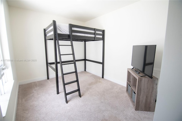 bedroom with light colored carpet