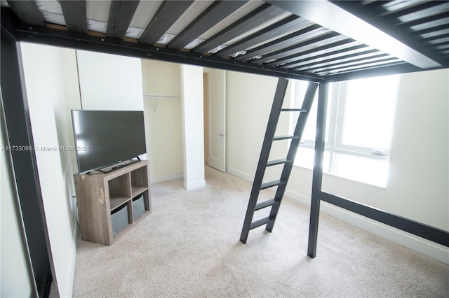 interior space featuring light colored carpet