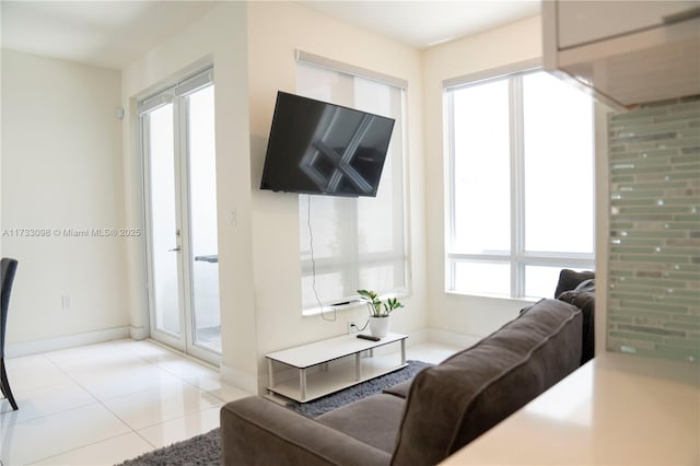 living room featuring light tile patterned floors and plenty of natural light