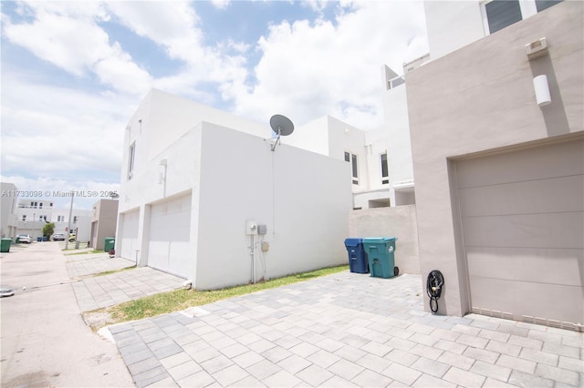 view of side of home with a garage