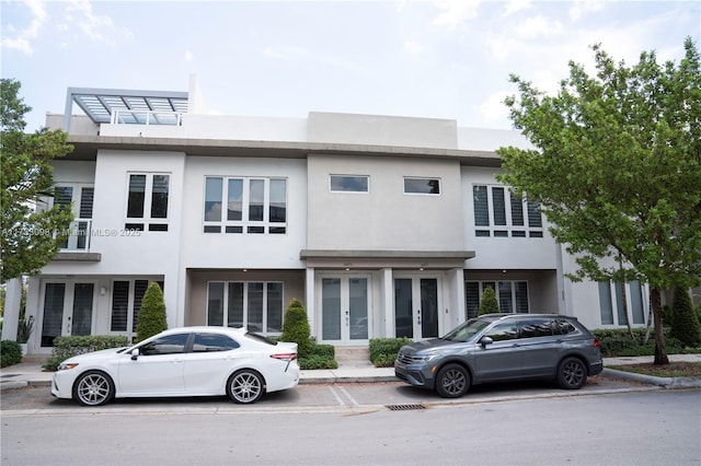 6475 NW 104th Ct Unit 6475, Doral, FL 33178 - townhome / multi-family property featuring french doors and stucco siding