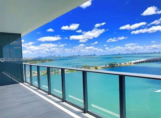 balcony featuring a water view