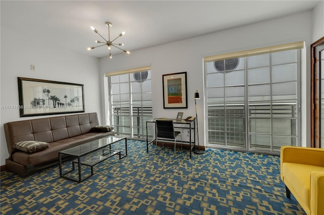 living room featuring carpet floors and an inviting chandelier