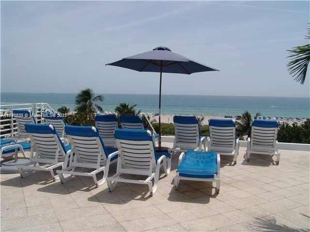 view of patio with a water view