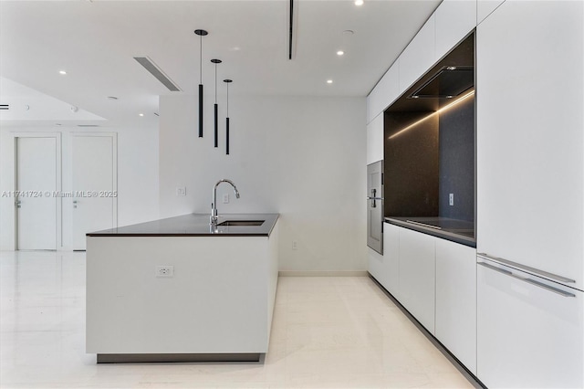 kitchen with white cabinetry, sink, pendant lighting, and black electric cooktop