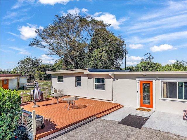 rear view of house with a deck