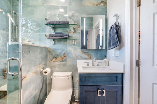 bathroom featuring vanity, a shower with shower door, tile walls, and toilet