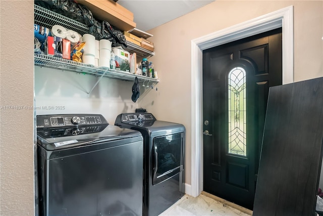 laundry room with separate washer and dryer