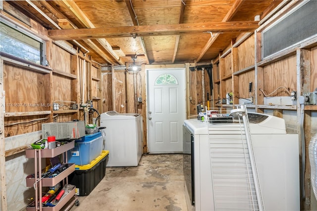 clothes washing area with washing machine and dryer