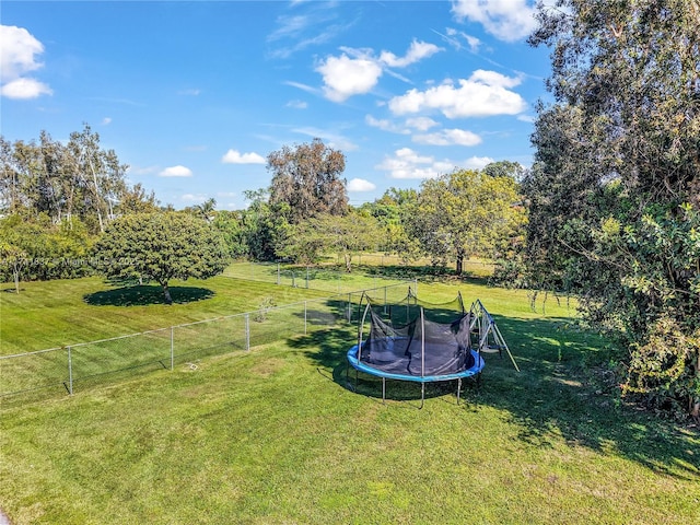 view of yard with a rural view and a trampoline