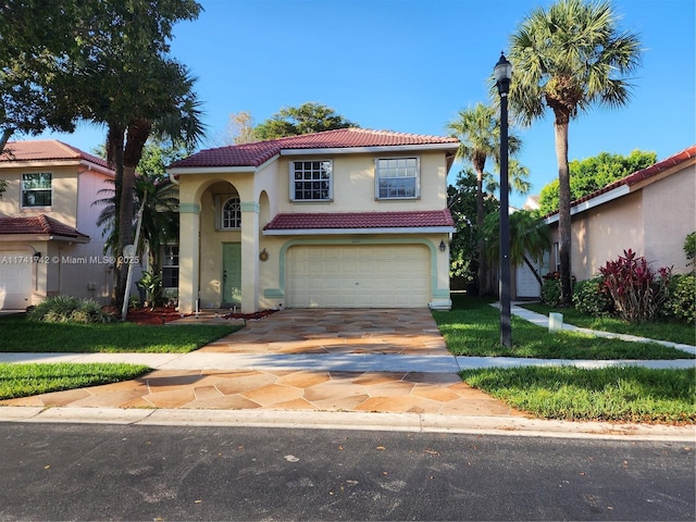 10265 N Serene Meadow Dr N, Boca Raton, FL 33428 - mediterranean / spanish home featuring a tile roof, an attached garage, stucco siding, and concrete driveway