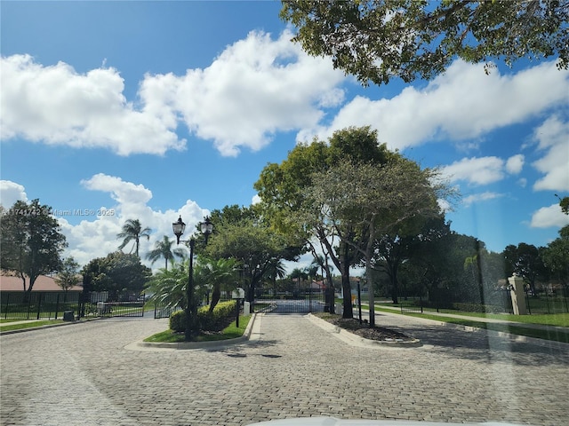 view of community featuring fence and a gate