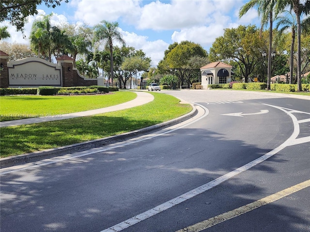 view of street with curbs