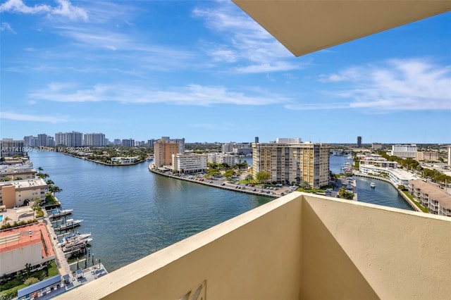 balcony featuring a view of city and a water view