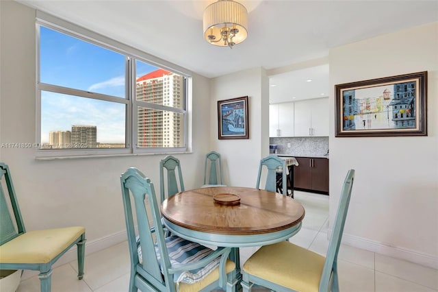1833 S Ocean Dr Unit 1612, Hallandale Beach, FL 33009 - dining space with light tile patterned flooring and baseboards