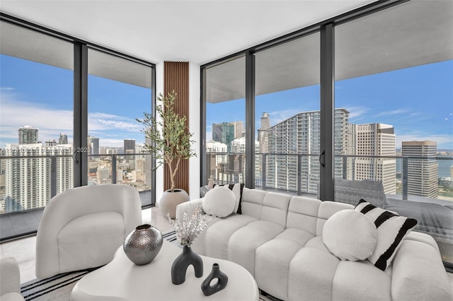 living room with a view of city and floor to ceiling windows