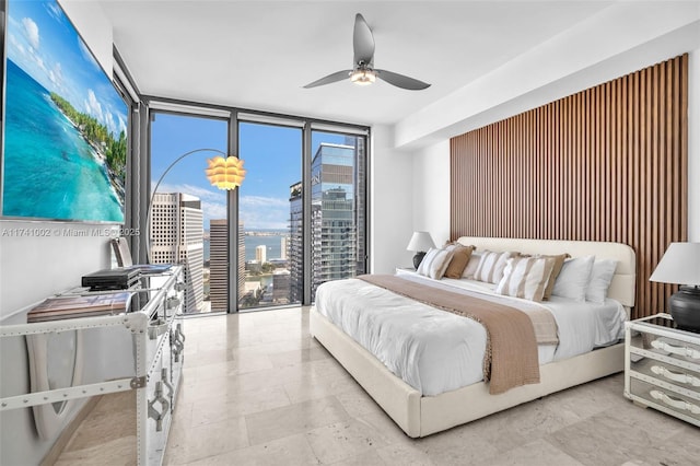 bedroom with access to exterior, floor to ceiling windows, and ceiling fan