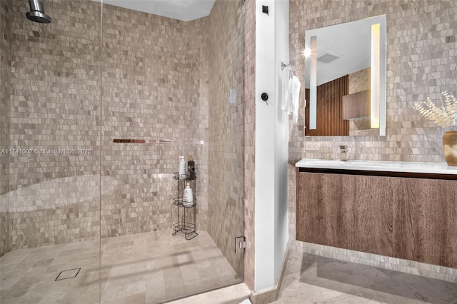 bathroom featuring a shower stall, visible vents, and vanity