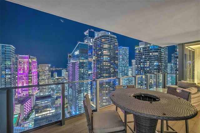 balcony at twilight with a view of city lights