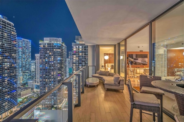 balcony at twilight with a view of city lights