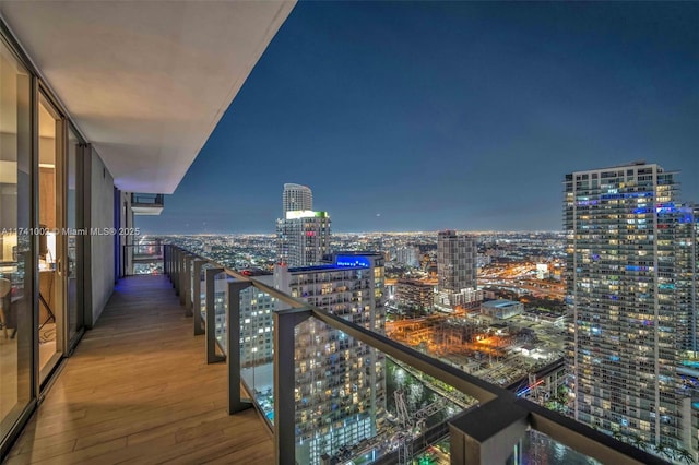 balcony featuring a view of city lights