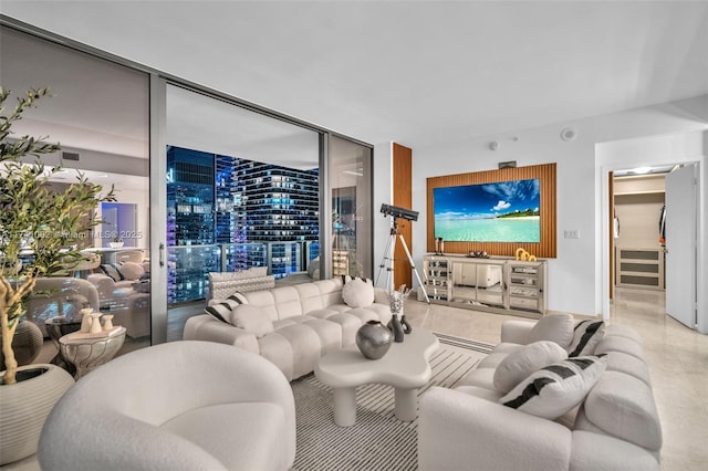 living room with beverage cooler, a wall of windows, and visible vents