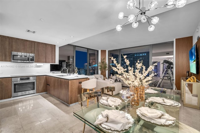 dining room with visible vents and a chandelier